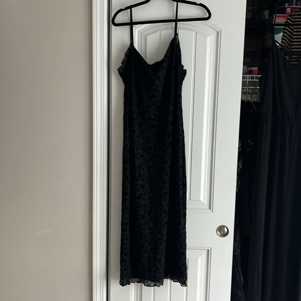 Black adjustable strap tank dress with floral pattern